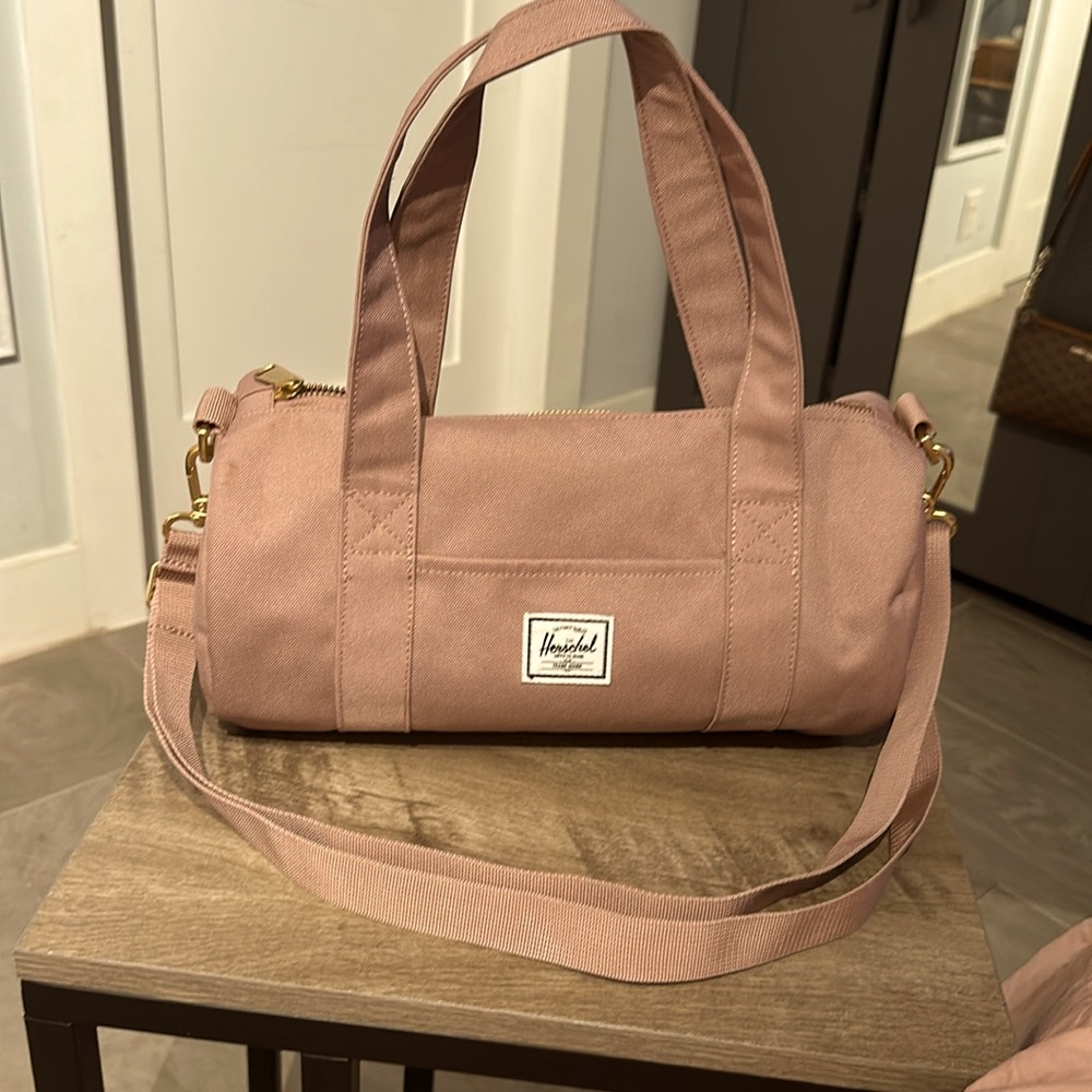 PINK HERSCHEL SUPPLY COMPANY SMALL DUFFLE BAG. EXCELLENT CONDITION